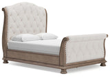 Ardenfield Upholstered Sleigh Bed and 2 Nightstands